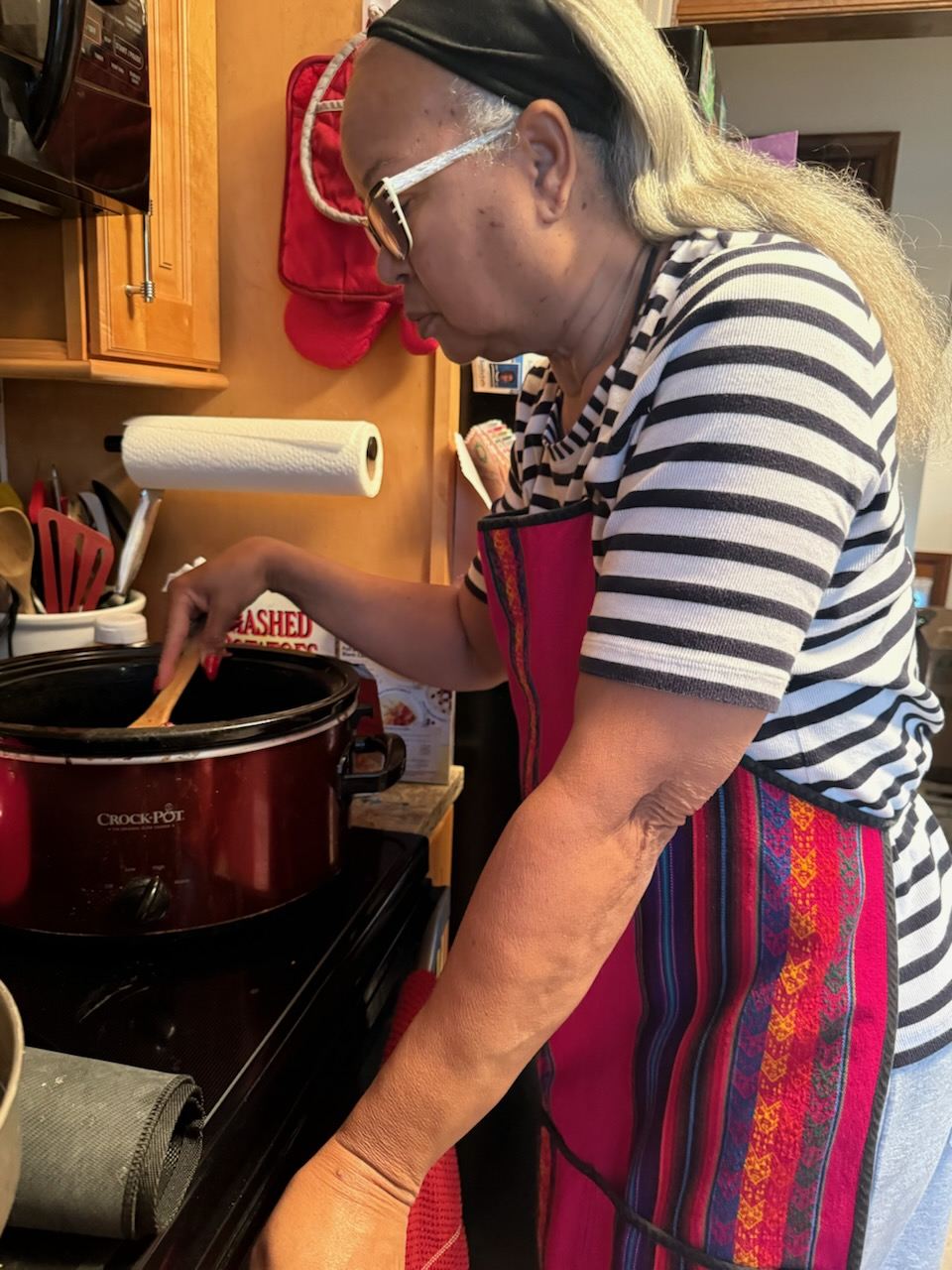 Caregiver preparing a home-cooked meal for a client