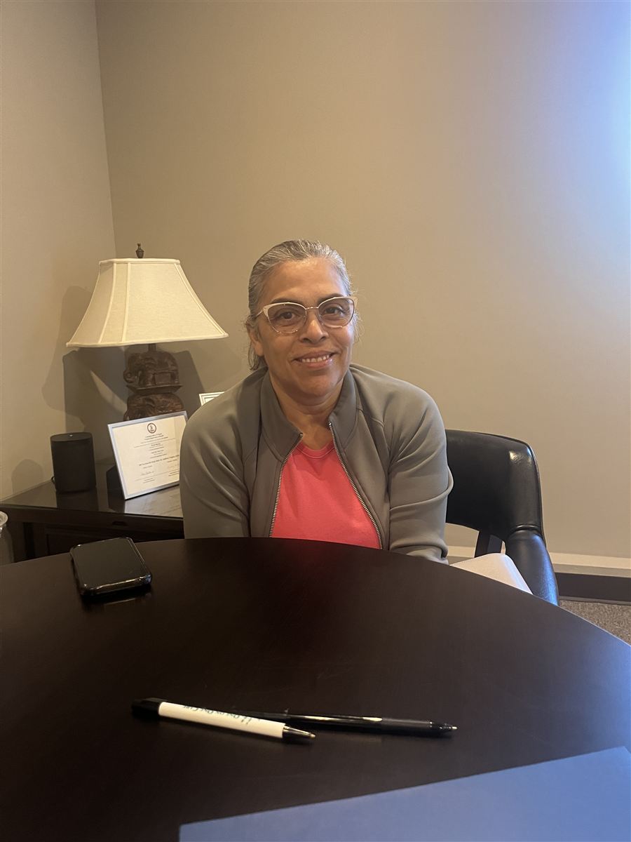 A One on One Care team member meeting with a family at the office