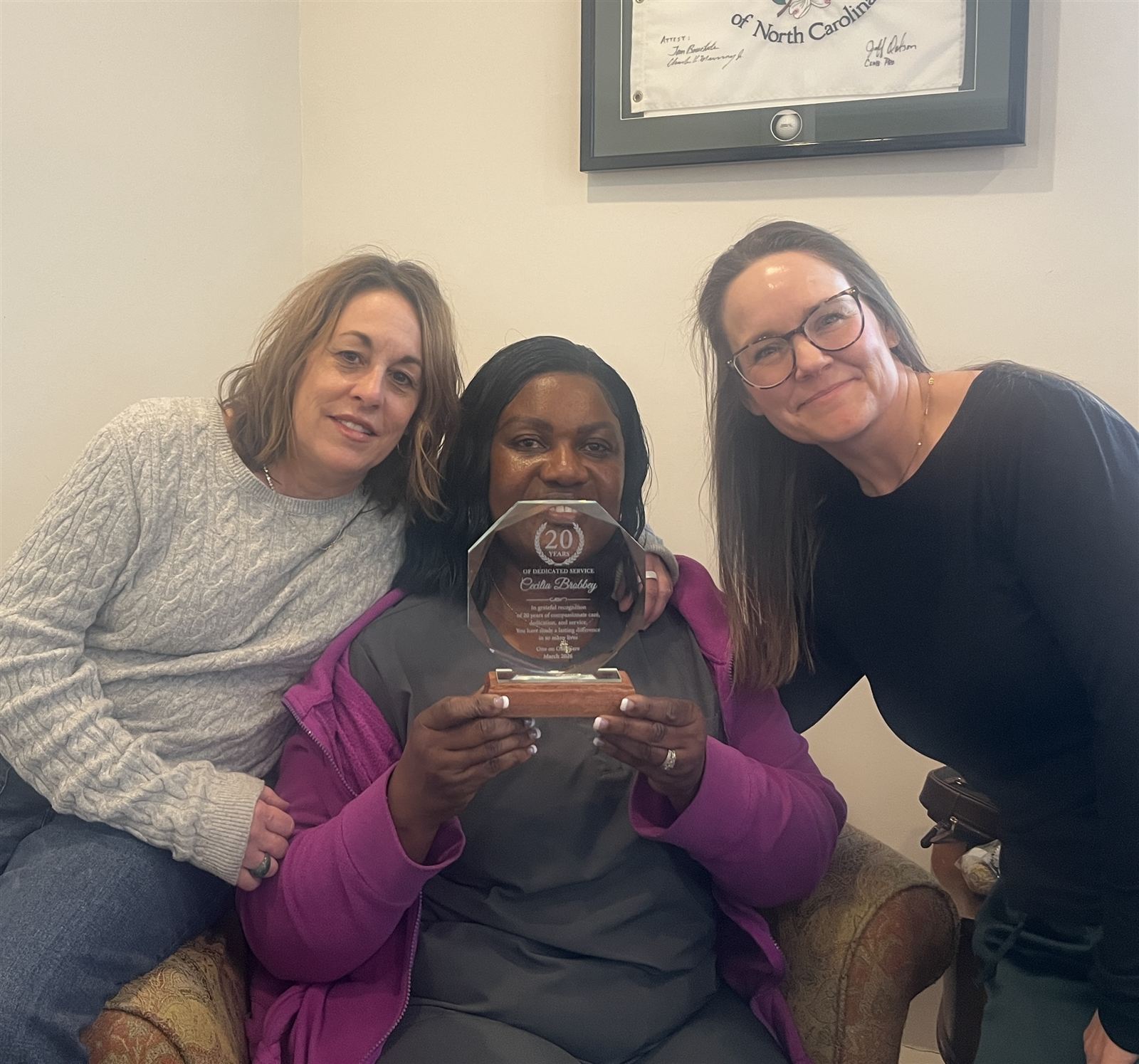 One on One Care team members celebrating twenty years of caregiving service